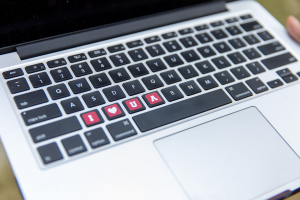 laptop with i heart u a on keyboard